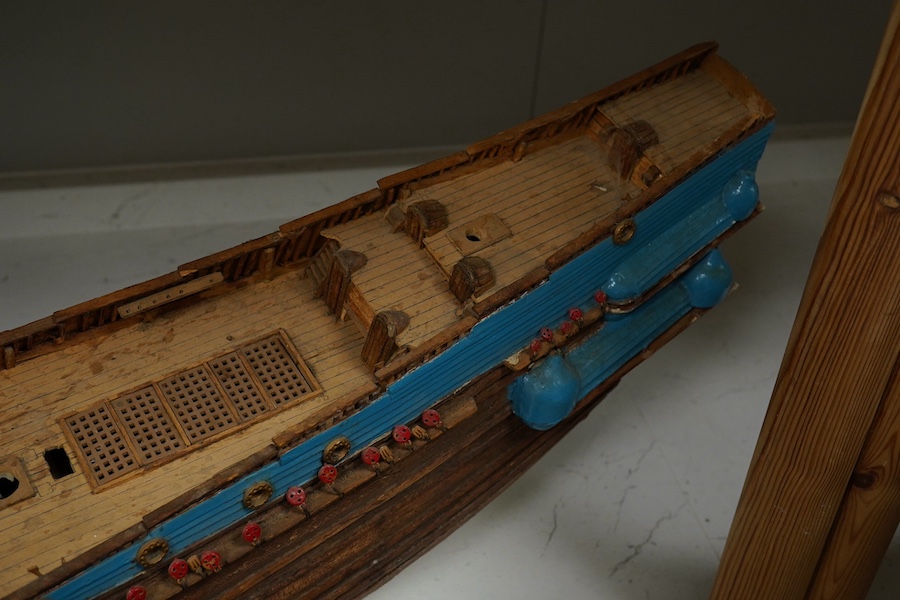 A scratch built model of a ship and a toy racing car and driver, ship 89cm wide. Condition - poor